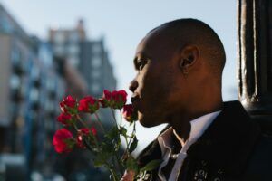 A man holding roses