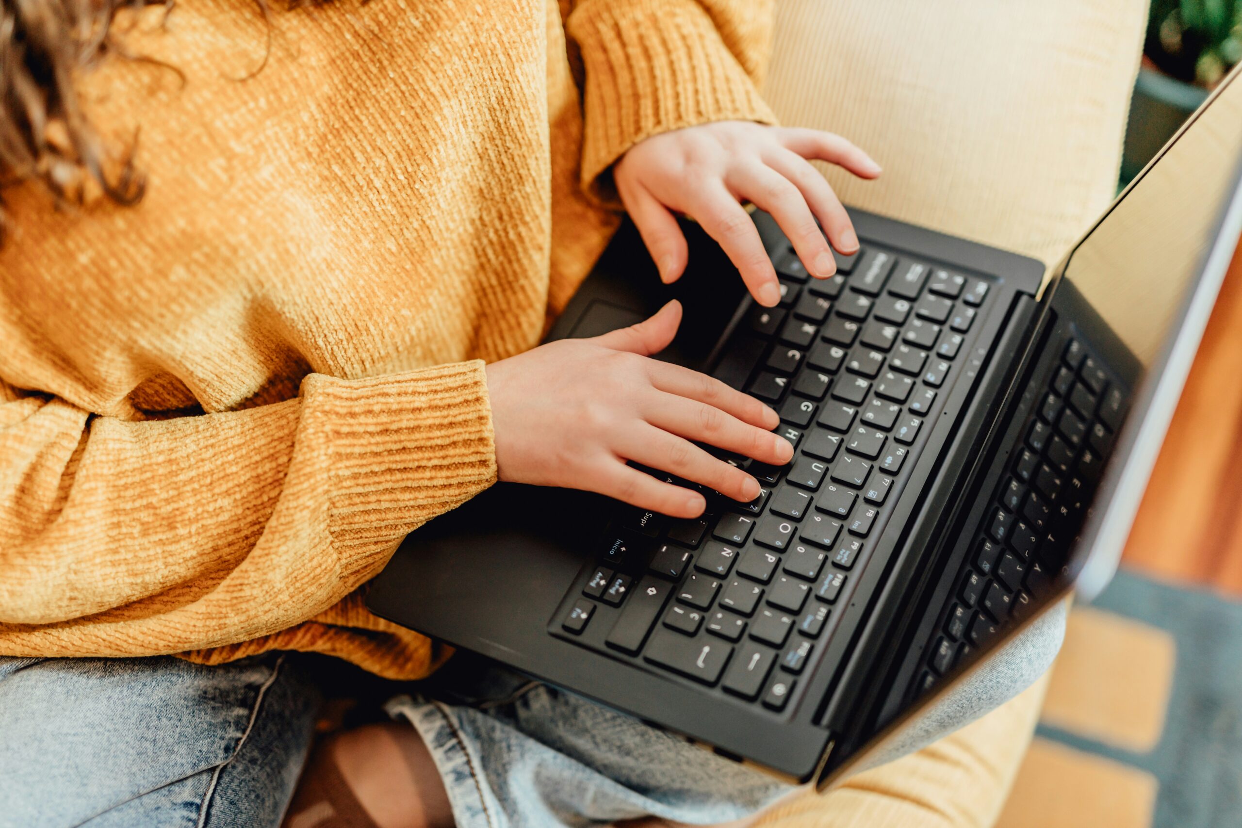 A woman on a laptop.