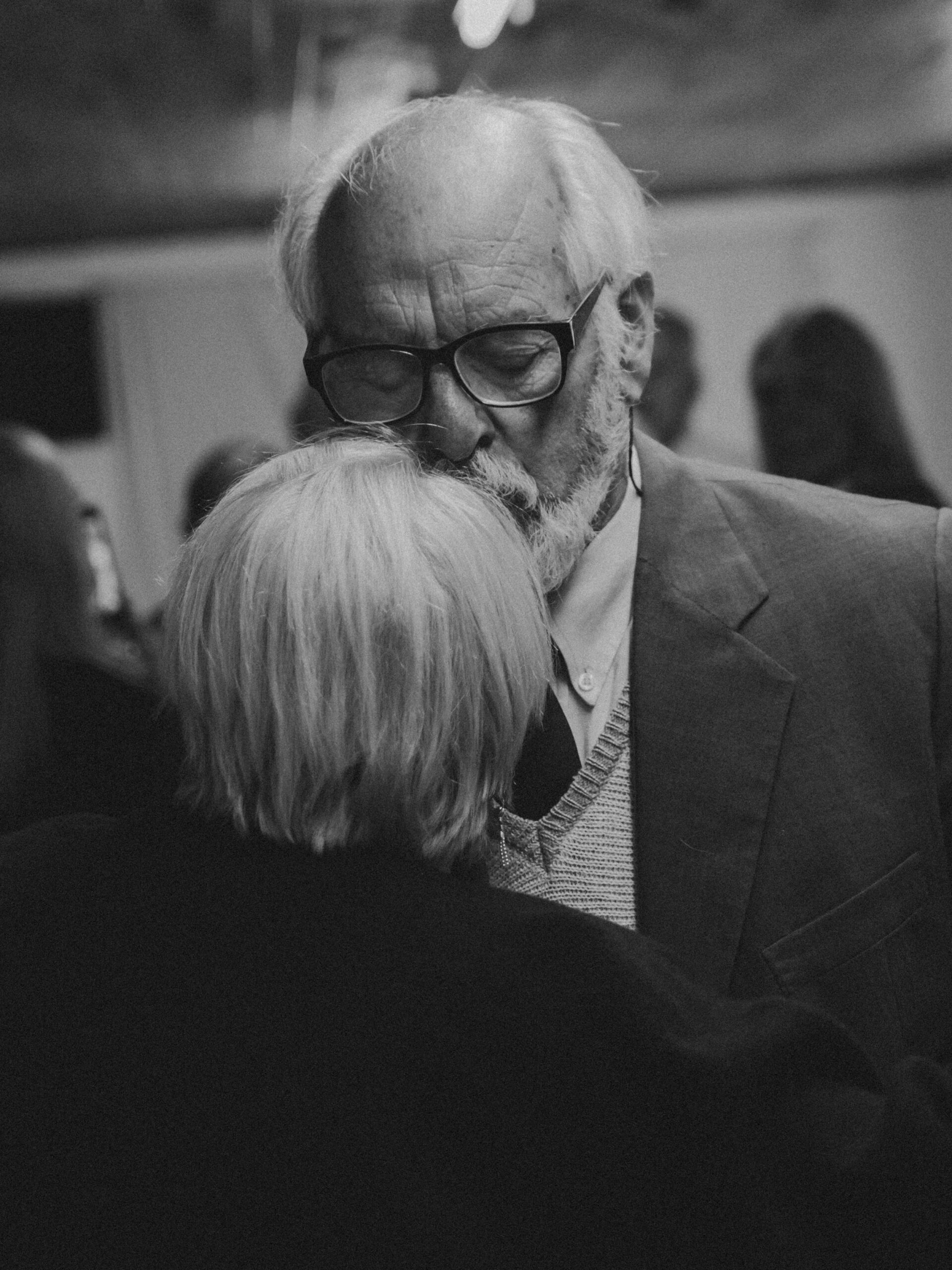 An older couple embracing each other's love.