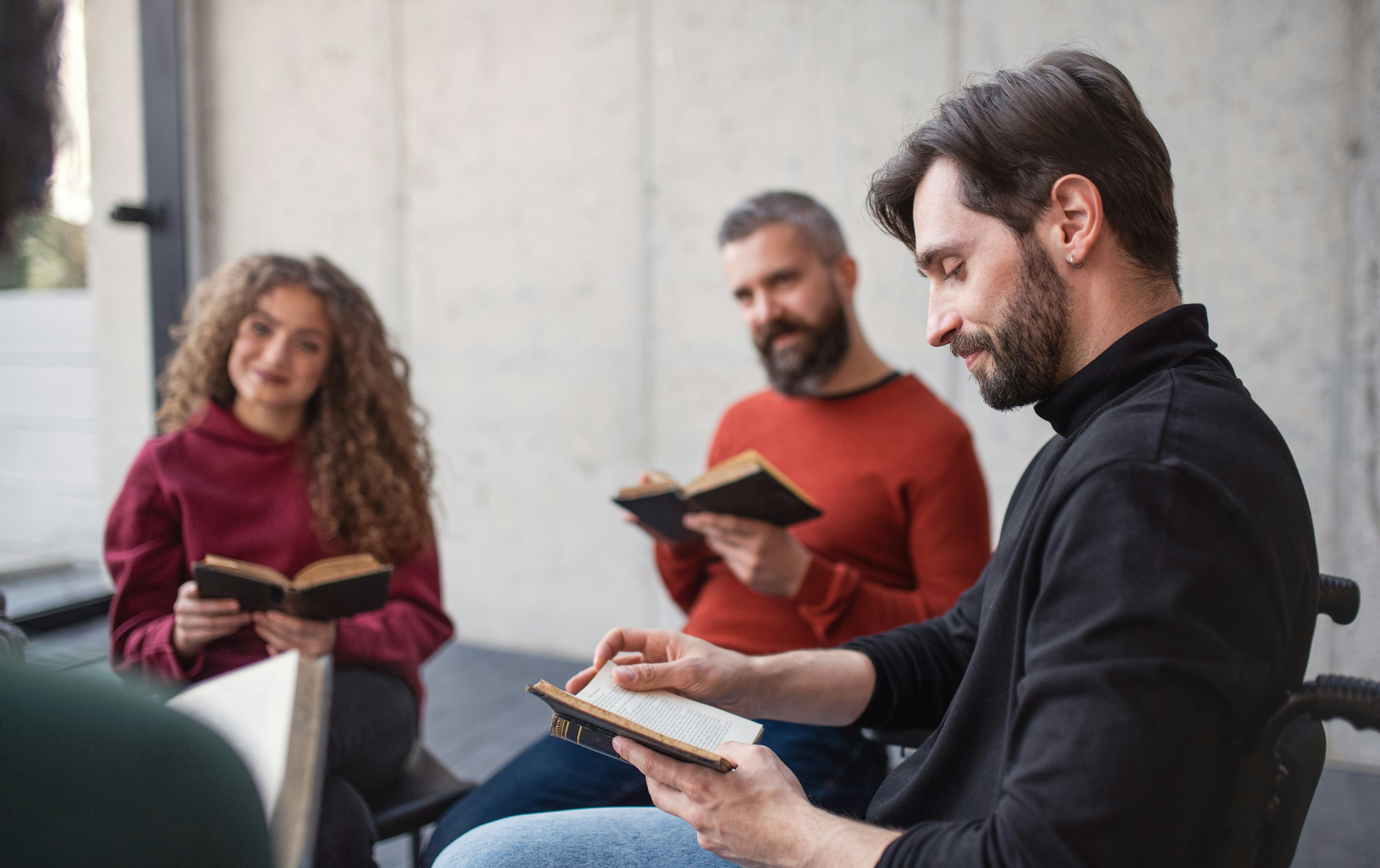 A group reciting from a book.