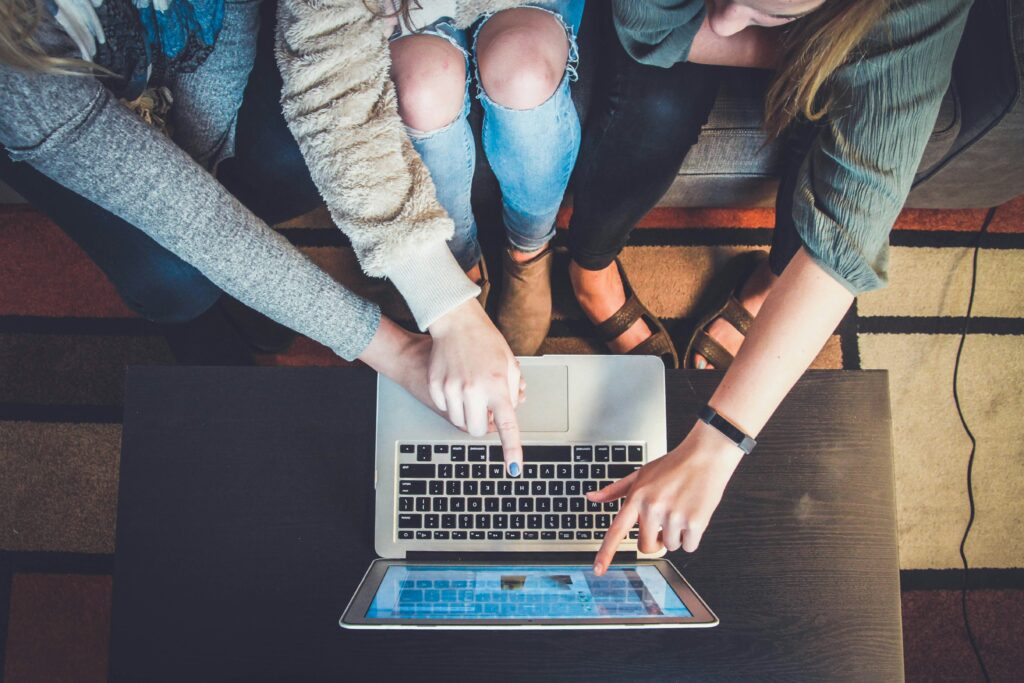 A group of women doing something on the internet.